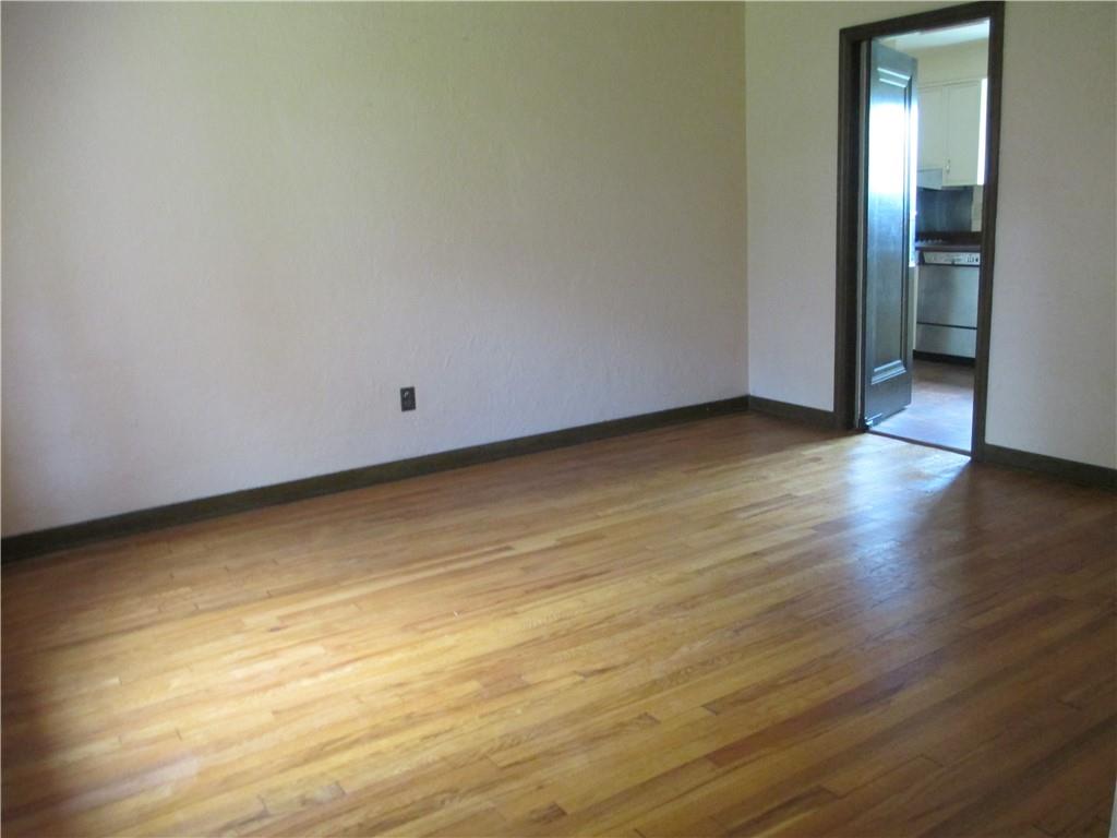 8 Holland Road Pittsburgh, PA 15235 - Photo 6 of 22 a view of an empty room and wooden floor