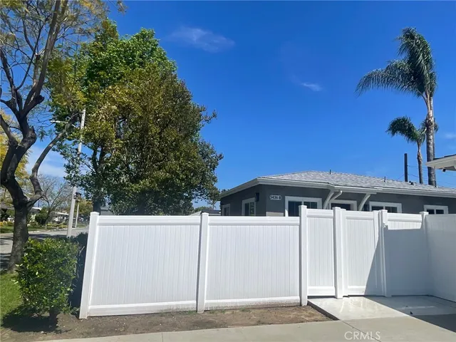 a view of a house with a tree