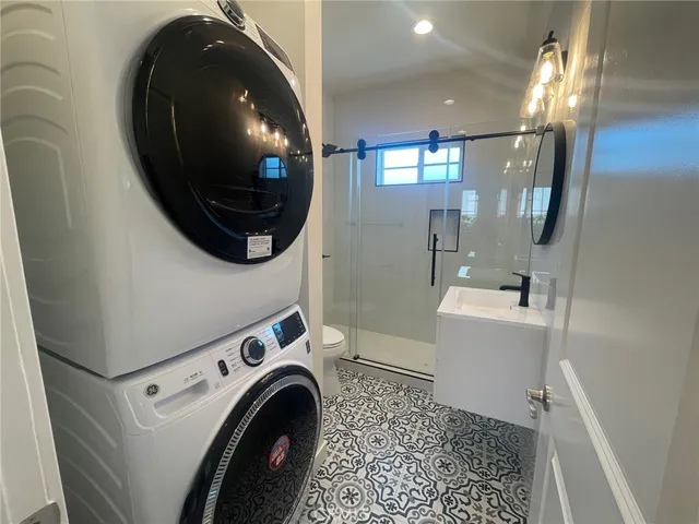 a view of a hallway with washer and dryer