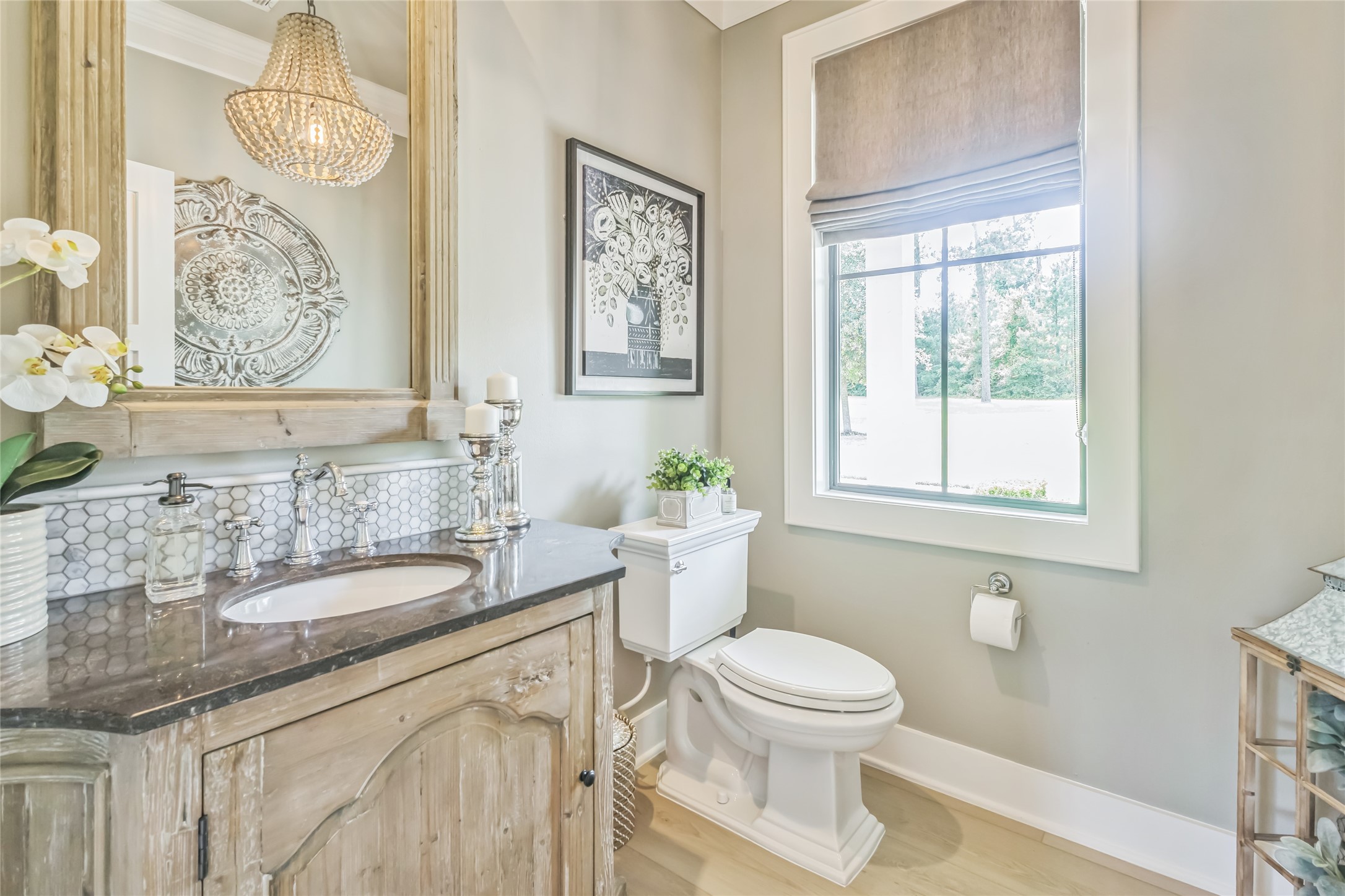 40498 Community Road Magnolia, TX 77354 - Photo 15 of 32 a bathroom with a granite countertop sink a toilet and a mirror