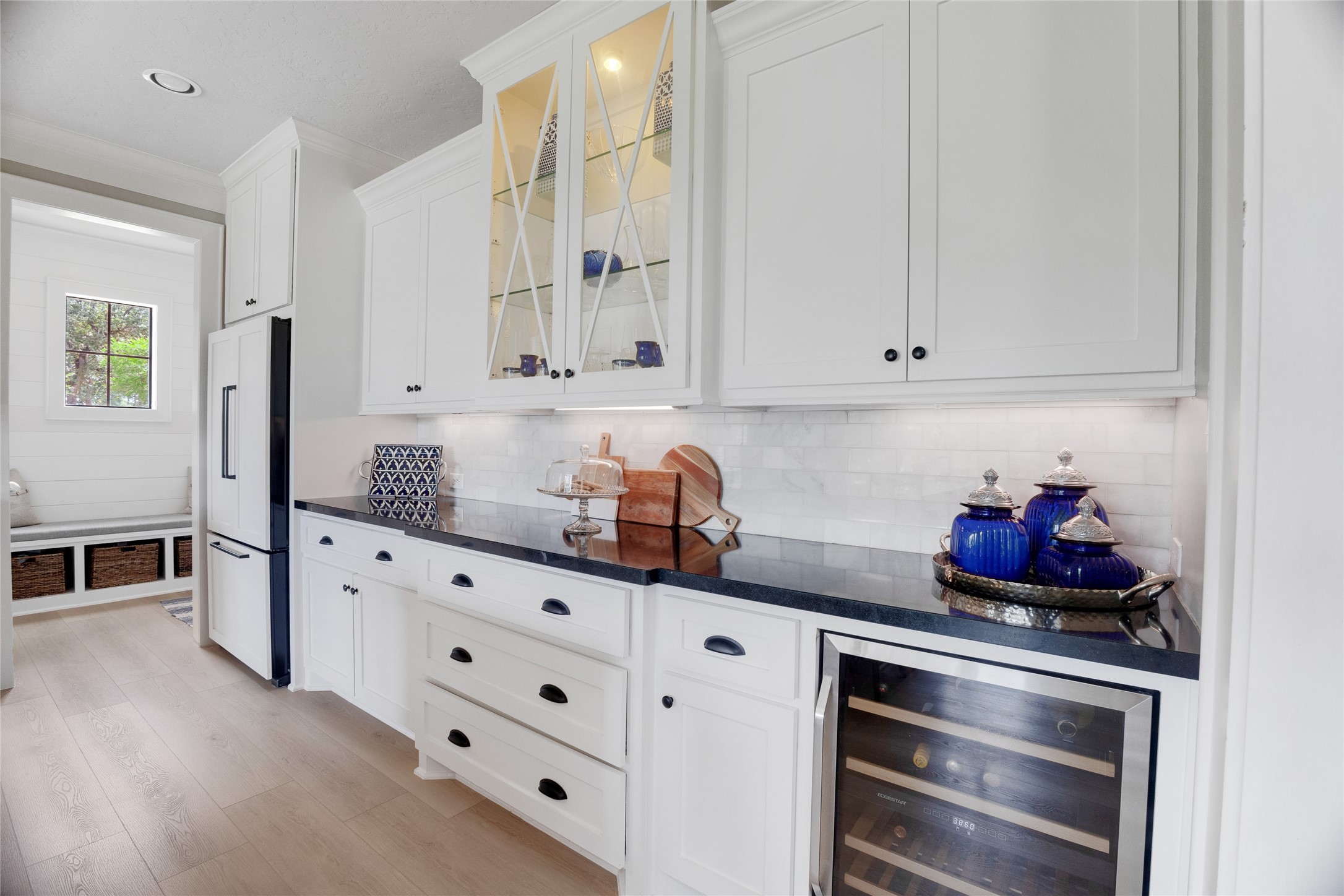 40498 Community Road Magnolia, TX 77354 - Photo 21 of 32 a kitchen with granite countertop white cabinets and stainless steel appliances