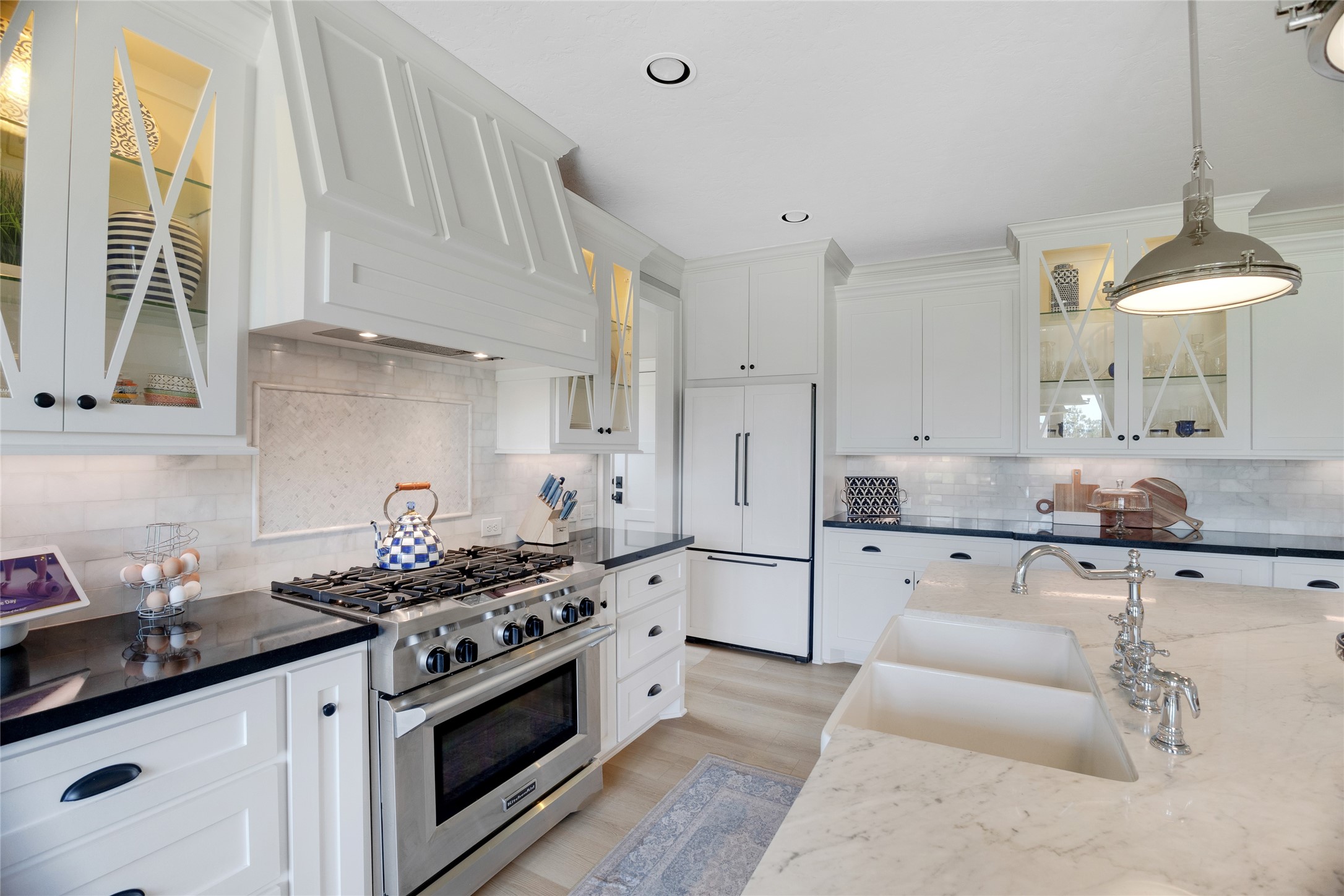 40498 Community Road Magnolia, TX 77354 - Photo 8 of 32 a kitchen with granite countertop a sink stove and cabinets