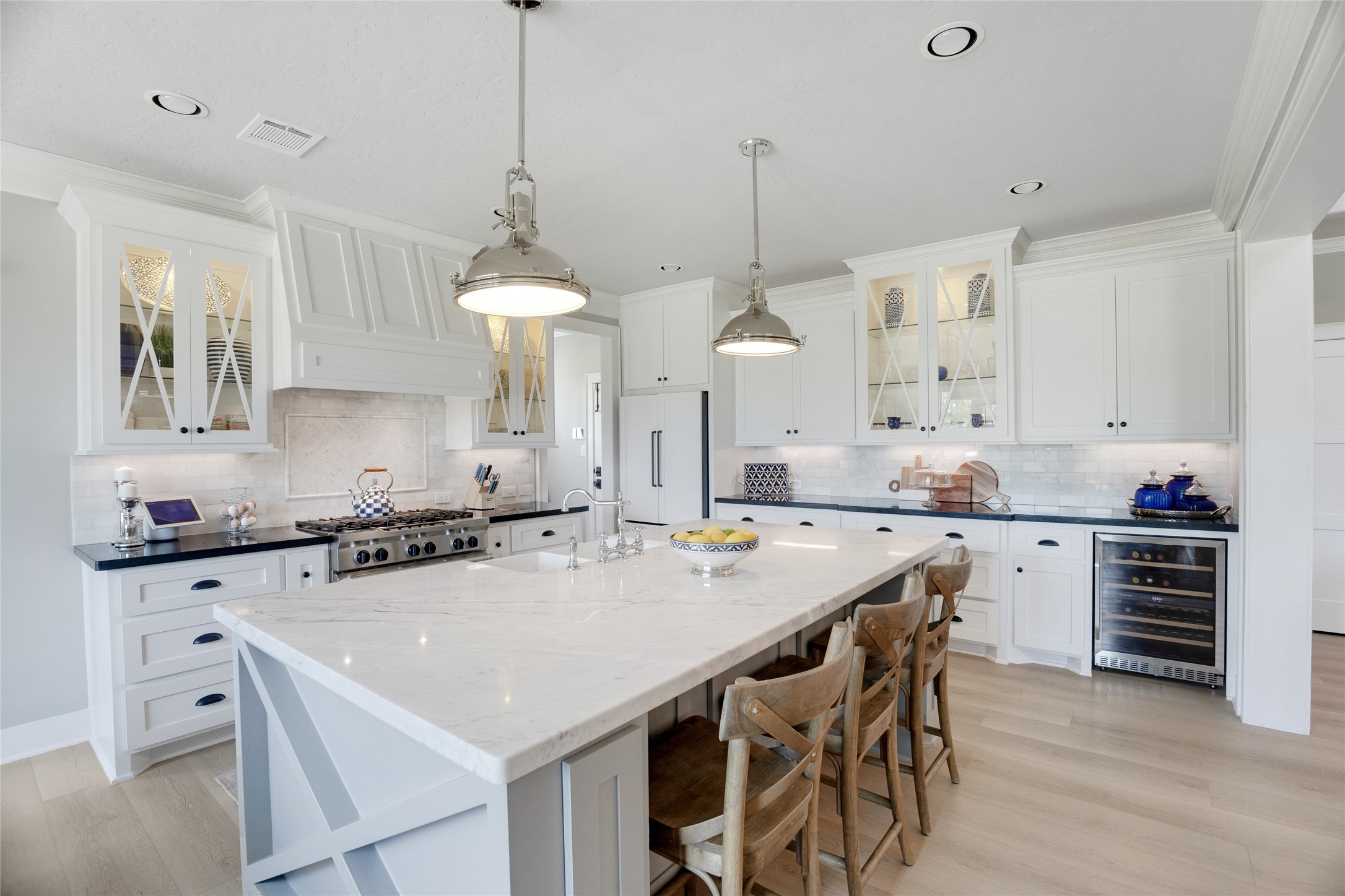 40498 Community Road Magnolia, TX 77354 - Photo 9 of 32 a kitchen with granite countertop a sink a center island and cabinets