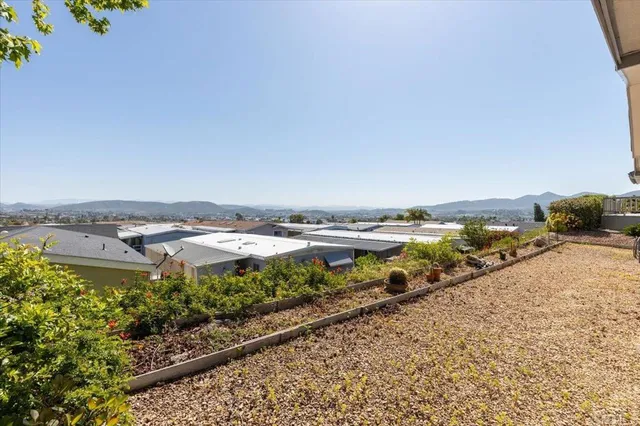 an aerial view of a house with a garden