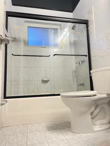 a view of a hallway with a potted plant