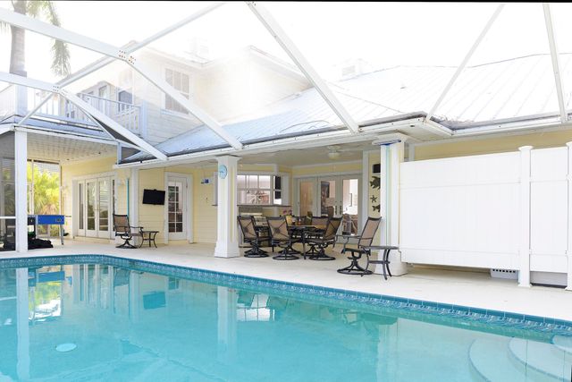 a wooden pier with boats in a lake