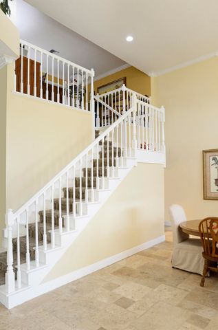 a living room with a large window and a table