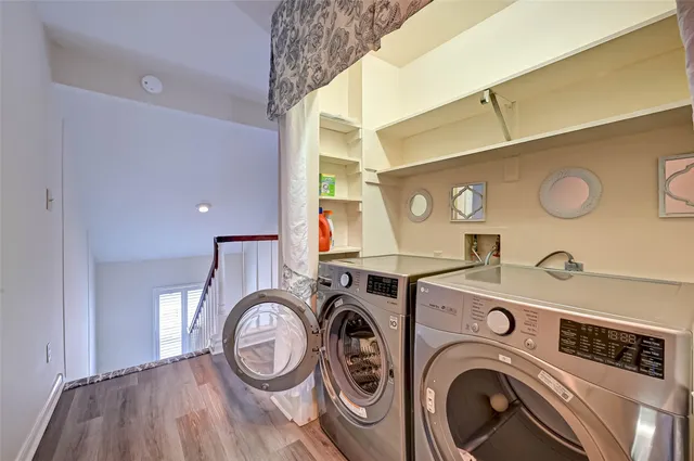 a view of storage and utility room with washer and dryer