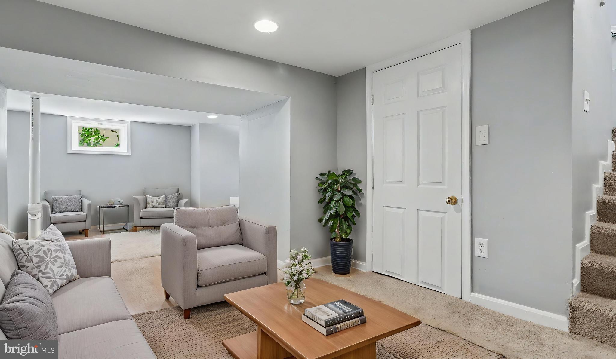 4203 Shell Street Capitol Heights, MD 20743 - Photo 23 of 47 a living room with furniture and a potted plant