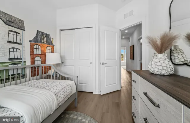 a bedroom with a bed and a book shelf