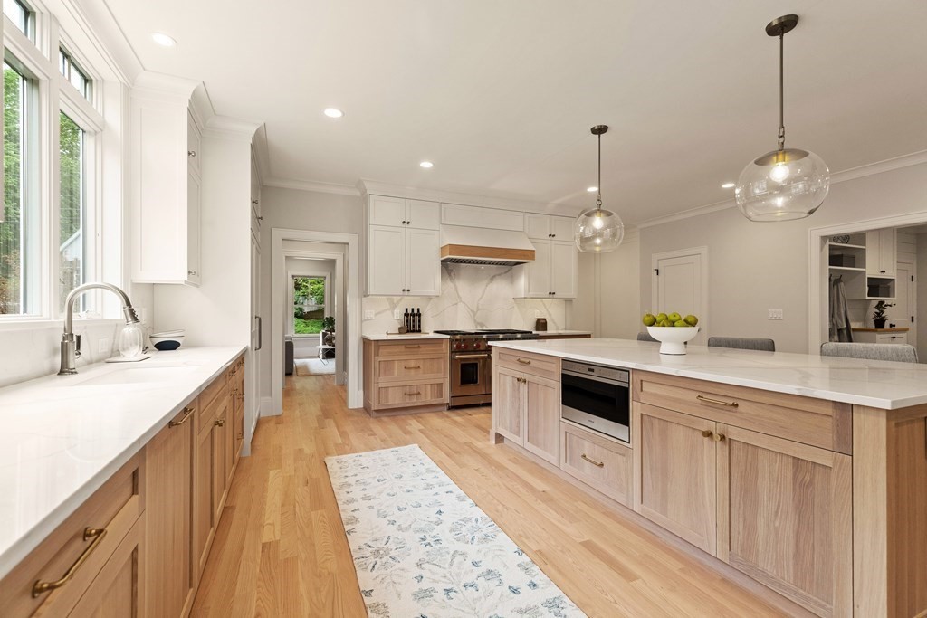 11 Sherman Street Lexington, MA 02420 - Photo 11 of 40 a large kitchen with kitchen island a sink stainless steel appliances and cabinets