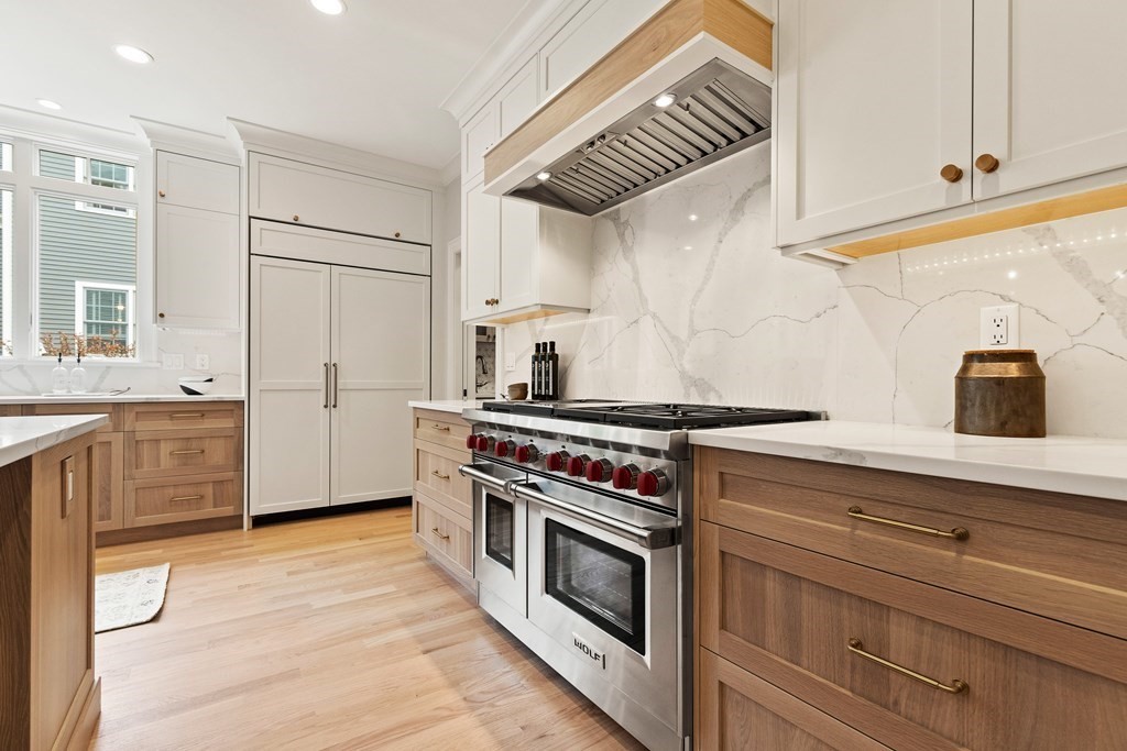 11 Sherman Street Lexington, MA 02420 - Photo 12 of 40 a kitchen with granite countertop a stove and a sink