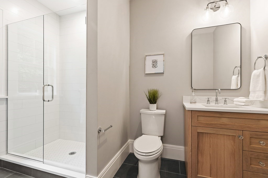 11 Sherman Street Lexington, MA 02420 - Photo 22 of 40 a bathroom with a toilet sink and shower