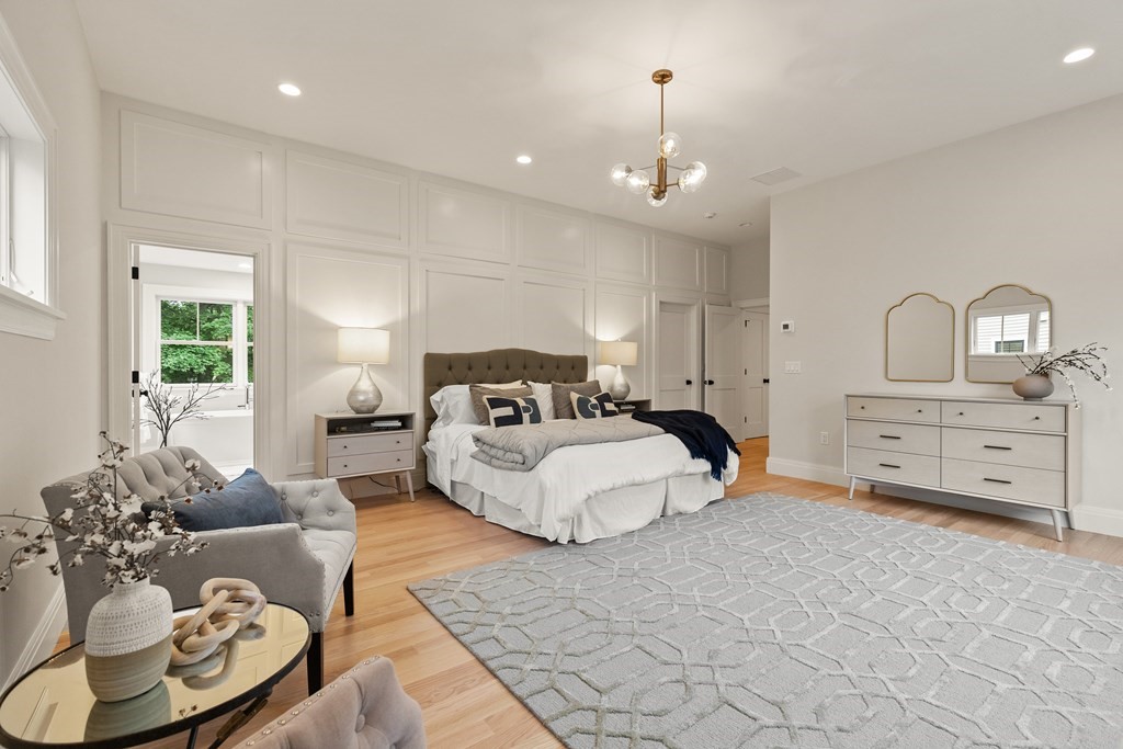 11 Sherman Street Lexington, MA 02420 - Photo 24 of 40 a spacious bedroom with a bed and a couch