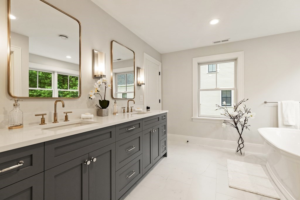 11 Sherman Street Lexington, MA 02420 - Photo 27 of 40 a spacious bathroom with a double vanity sink mirror and double
