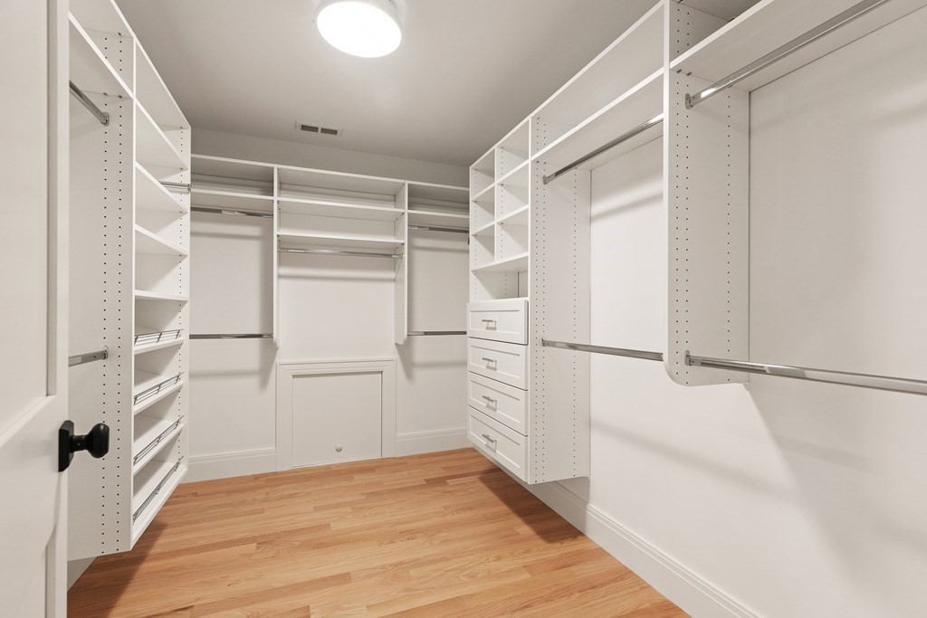 11 Sherman Street Lexington, MA 02420 - Photo 28 of 40 a view of walk in closet with empty racks