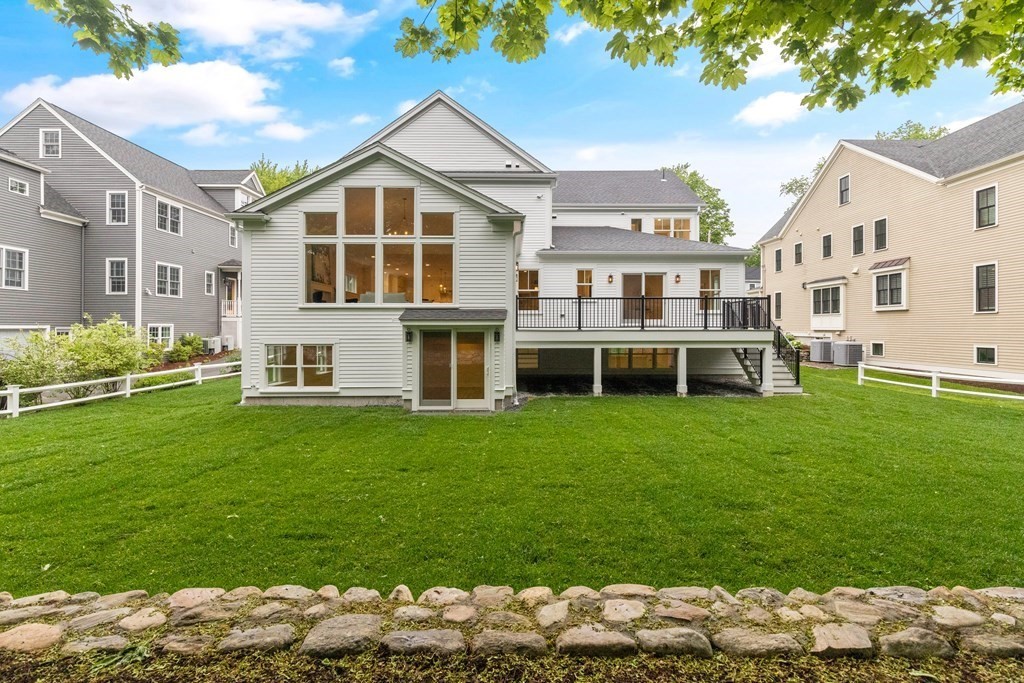 11 Sherman Street Lexington, MA 02420 - Photo 40 of 40 a view of a big house with a big yard and large trees