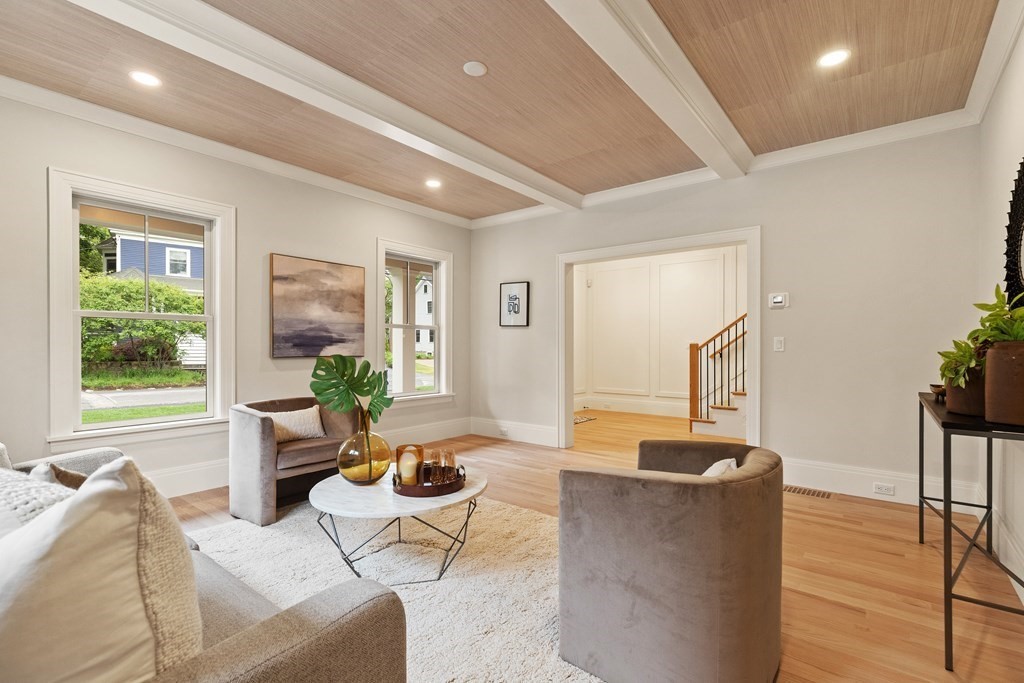 11 Sherman Street Lexington, MA 02420 - Photo 6 of 40 a living room with furniture and a large window