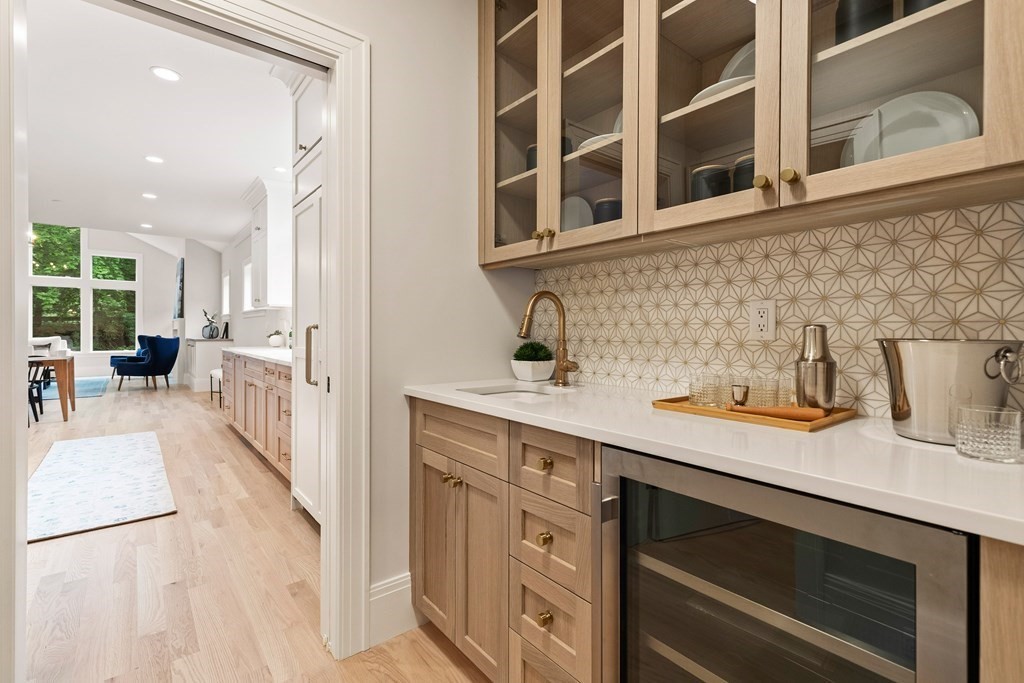 11 Sherman Street Lexington, MA 02420 - Photo 7 of 40 a view of a kitchen with a sink and cabinets