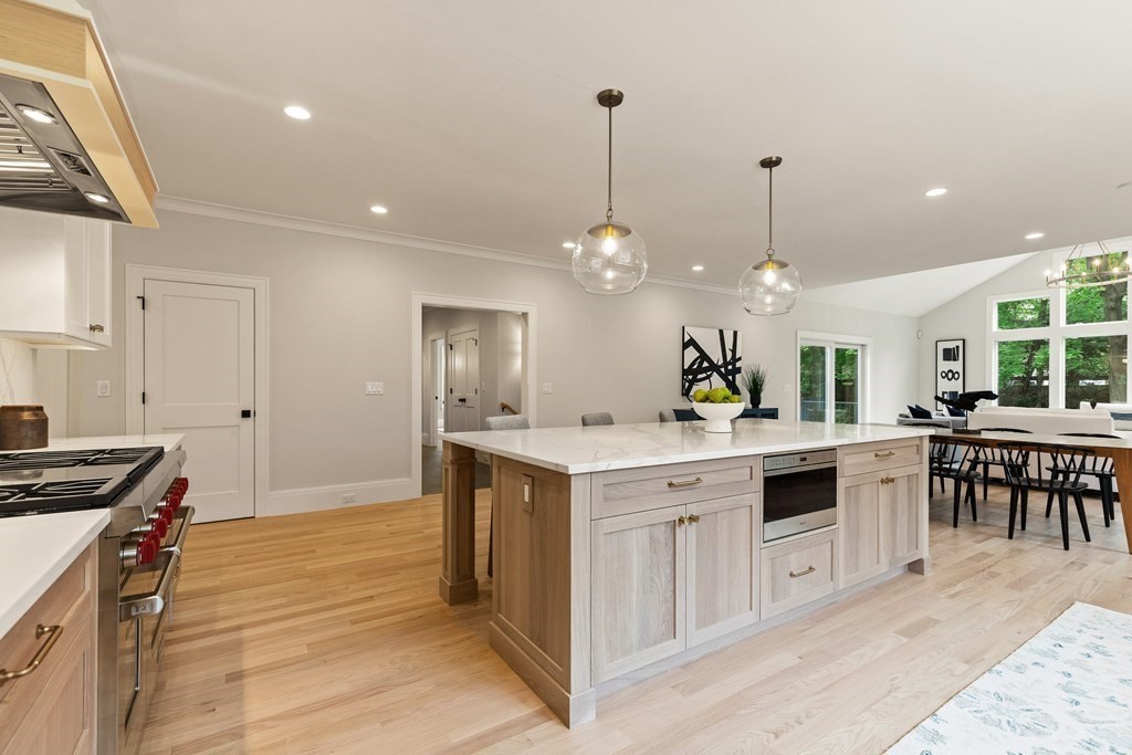 11 Sherman Street Lexington, MA 02420 - Photo 10 of 40 a kitchen with a sink stove and cabinets