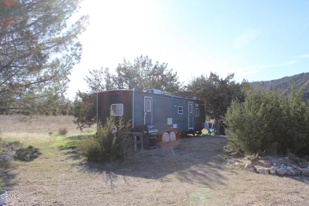 4190 Quatal Canyon Road Maricopa, CA 93252 - Photo 14 of 41 a view of a barn in the middle of a yard