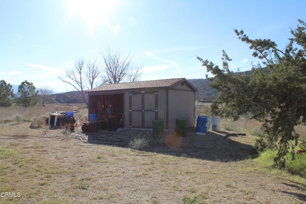 4190 Quatal Canyon Road Maricopa, CA 93252 - Photo 20 of 41 a view of a house with a yard covered in snow