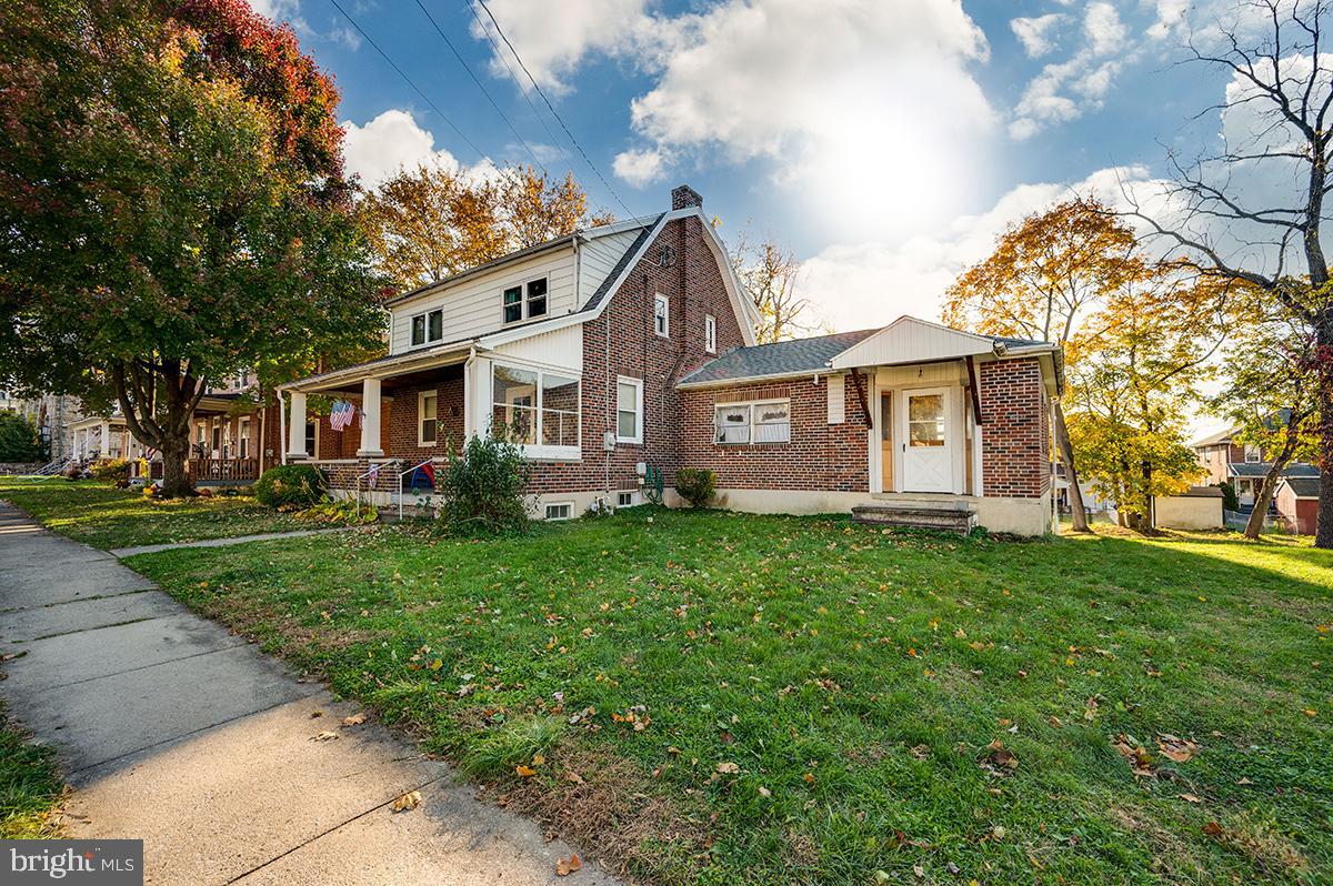 3424 Fremont Street Reading, PA 19605 - Photo 1 of 51 a front view of a house with a garden and plants