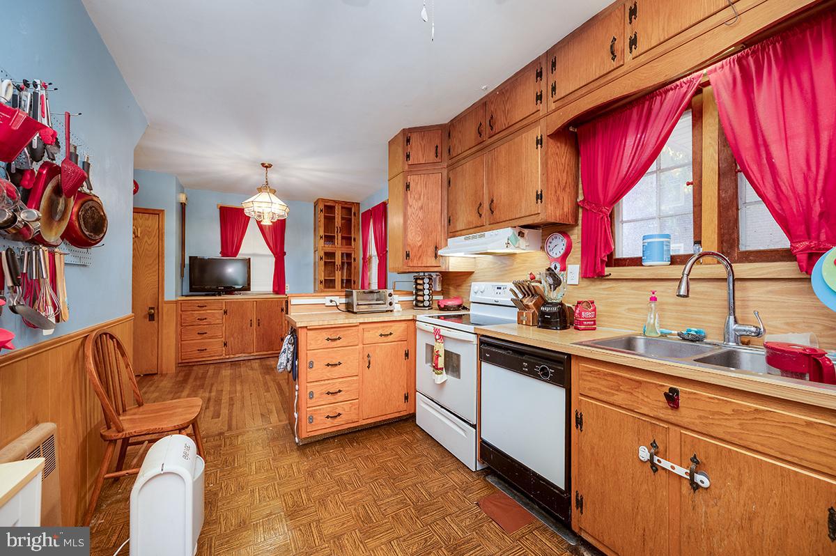 3424 Fremont Street Reading, PA 19605 - Photo 13 of 51 a kitchen that has a lot of white cabinets and wooden floor