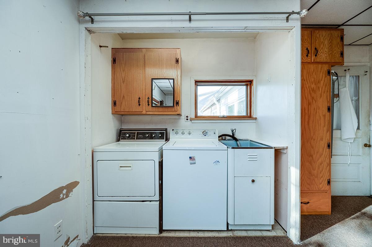 3424 Fremont Street Reading, PA 19605 - Photo 17 of 51 a view of cabinets and utility room with closet