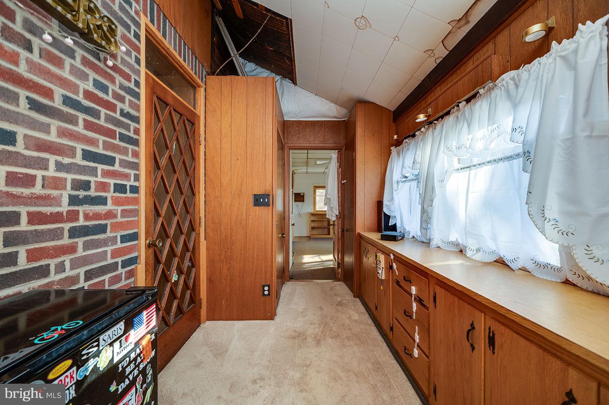 3424 Fremont Street Reading, PA 19605 - Photo 18 of 51 a hallway with a large kitchen space and wooden floor
