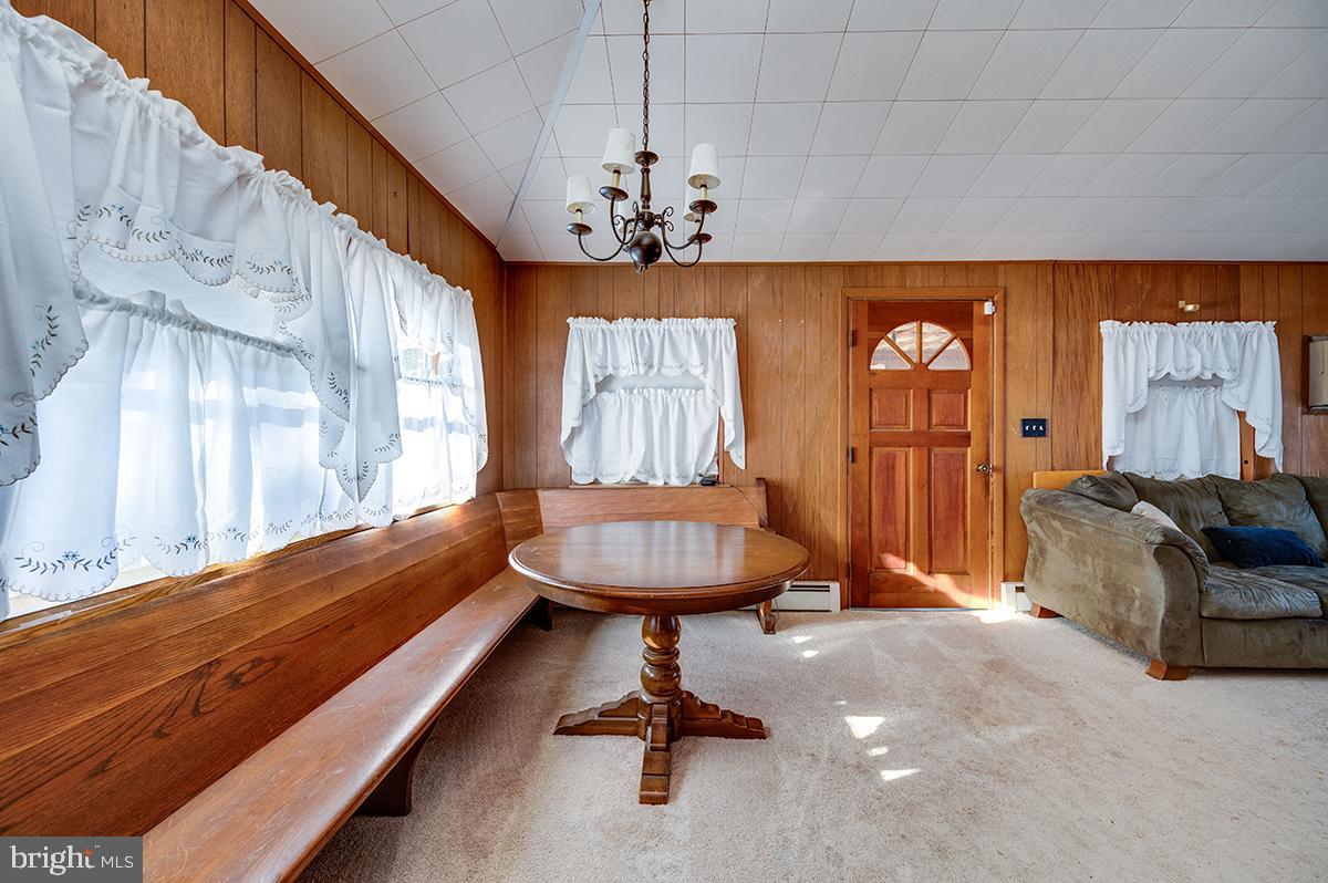 3424 Fremont Street Reading, PA 19605 - Photo 19 of 51 a living room with furniture and a chandelier