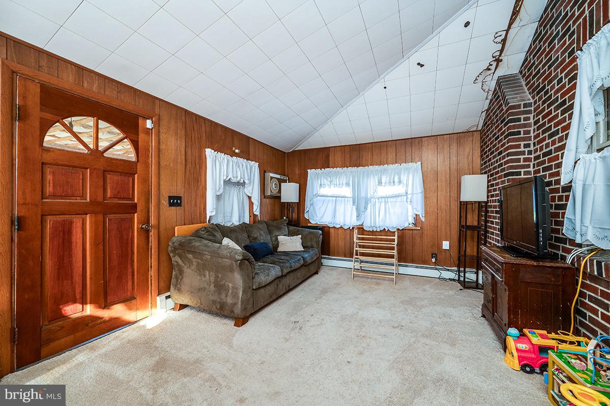3424 Fremont Street Reading, PA 19605 - Photo 20 of 51 a living room with furniture a flat screen tv and a window