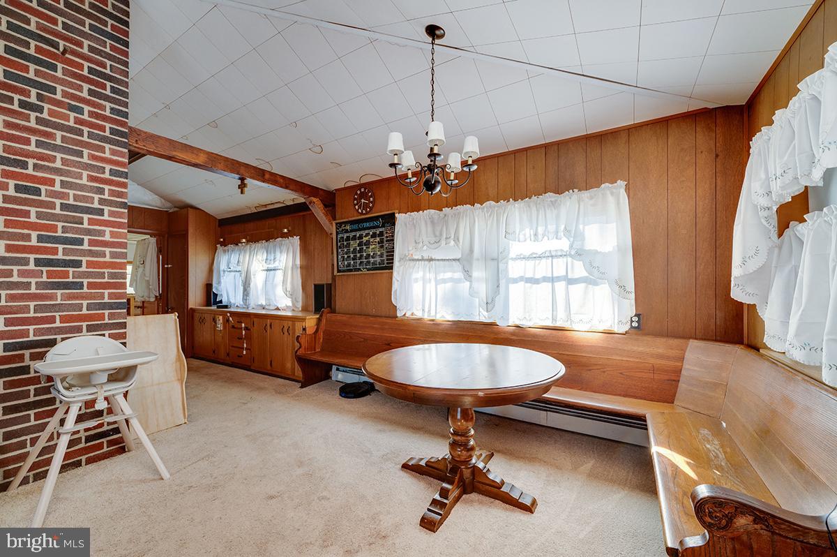 3424 Fremont Street Reading, PA 19605 - Photo 23 of 51 a living room with furniture a window and a chandelier
