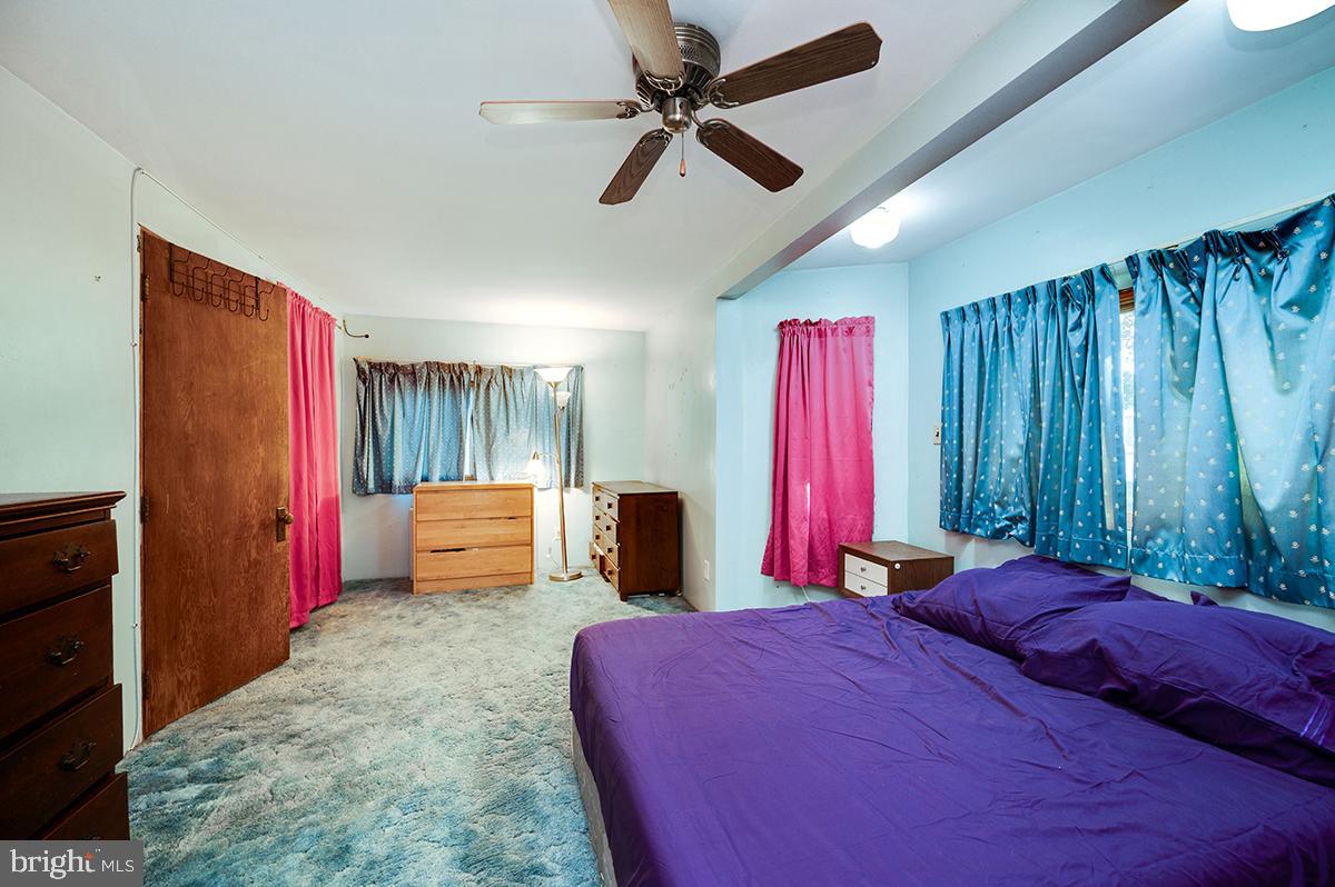 3424 Fremont Street Reading, PA 19605 - Photo 27 of 51 a bedroom with a large bed and a chandelier
