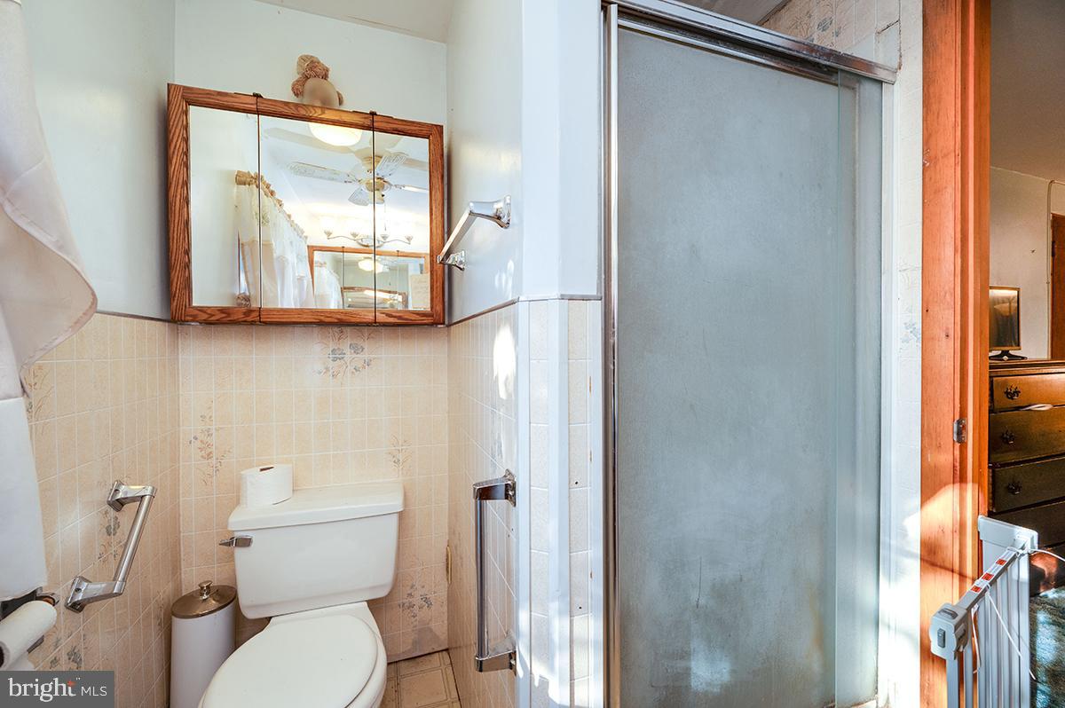 3424 Fremont Street Reading, PA 19605 - Photo 30 of 51 a bathroom with a toilet sink and mirror