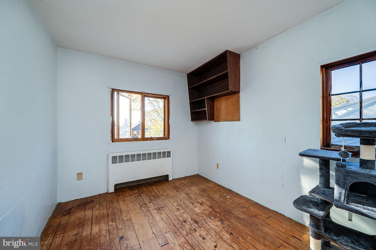 3424 Fremont Street Reading, PA 19605 - Photo 35 of 51 a view of a bedroom with wooden floor and windows