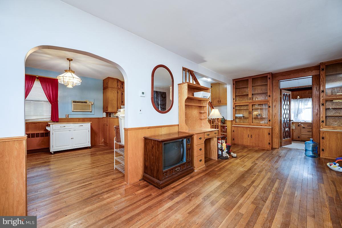 3424 Fremont Street Reading, PA 19605 - Photo 7 of 51 a living room with furniture a fireplace and wooden floor