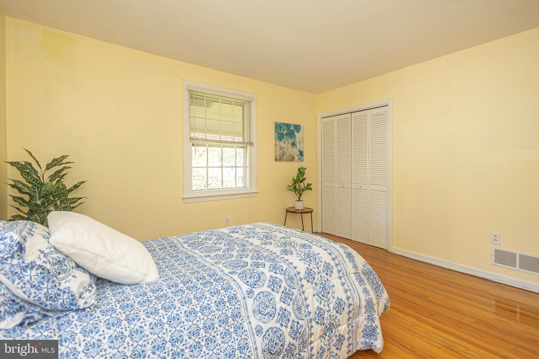 2316 Shipley Road Wilmington, DE 19803 - Photo 26 of 42 a bedroom with a bed and a window