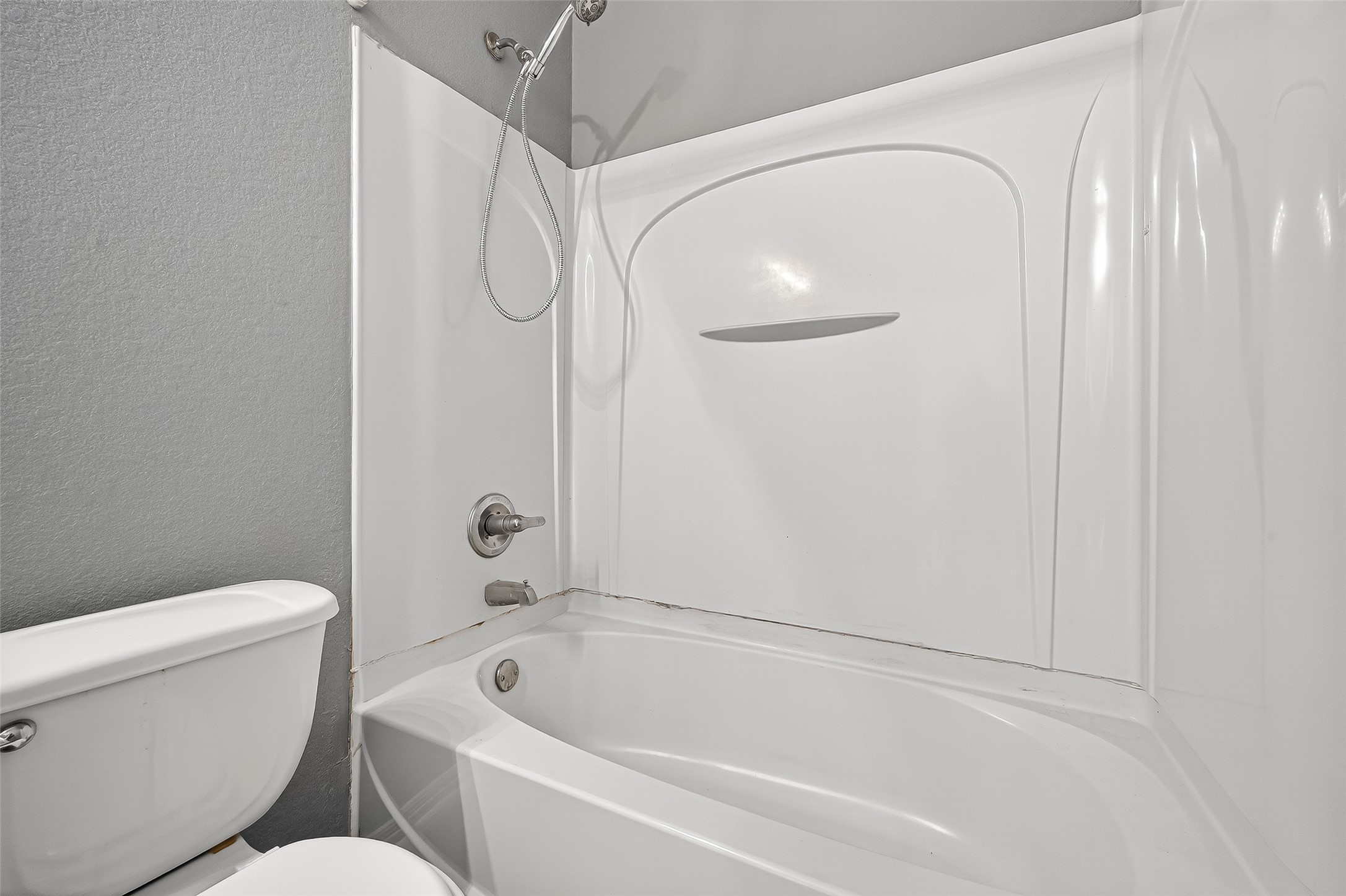 17230 Valhallah Way Houston, TX 77095 - Photo 36 of 48 a bathroom with a toilet and a bathtub