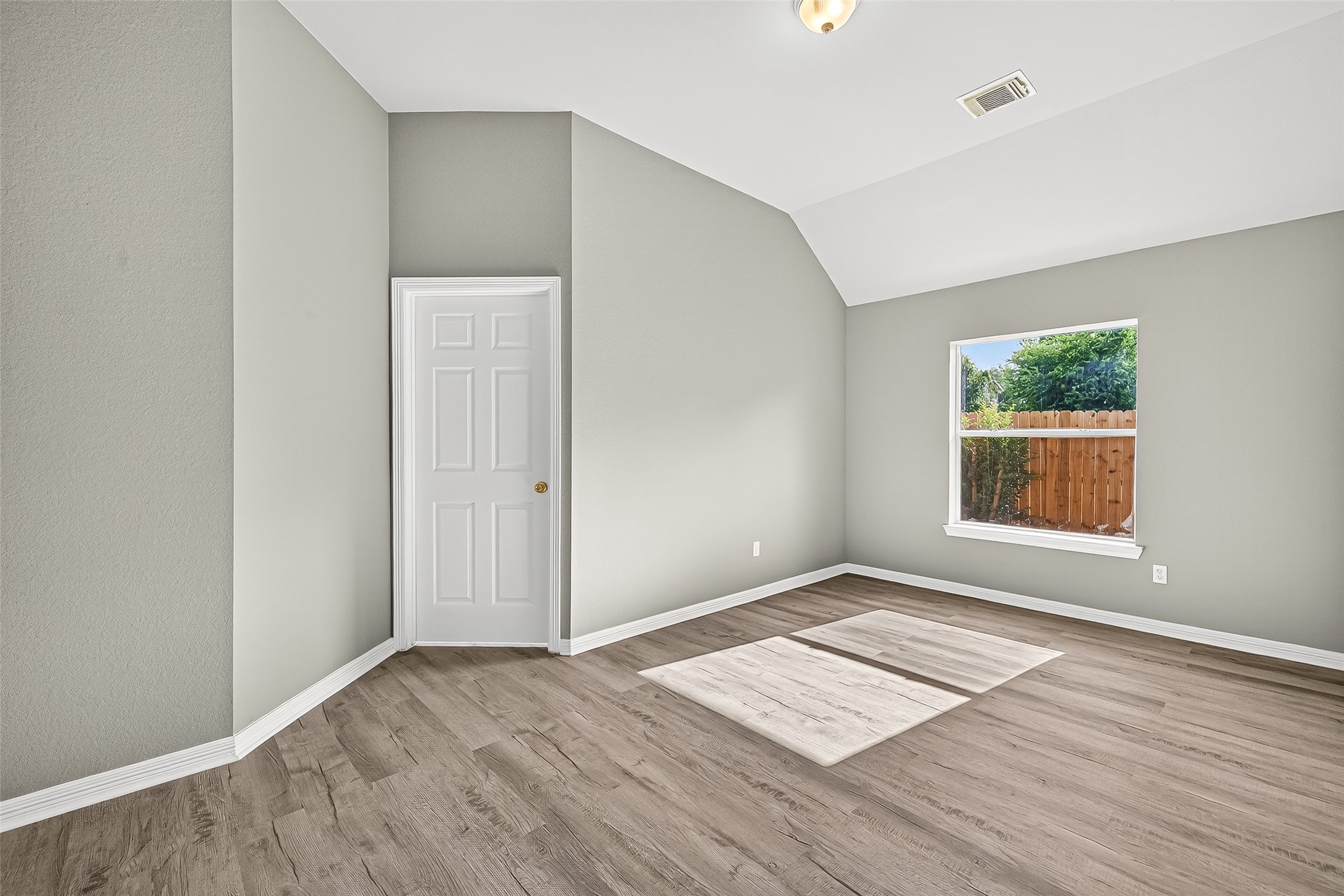 17230 Valhallah Way Houston, TX 77095 - Photo 37 of 48 an empty room with wooden floor and windows
