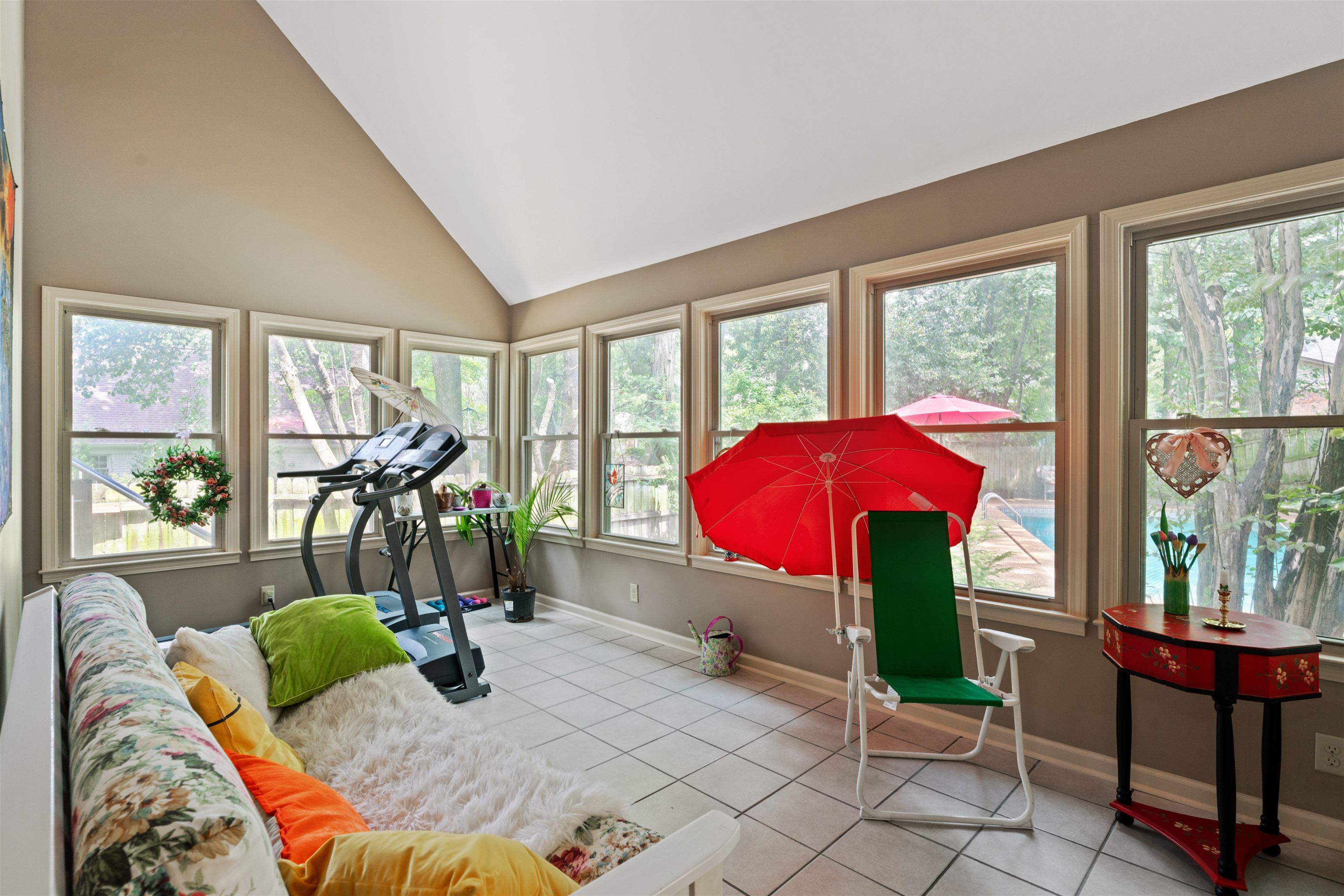 500 South Yates Road Memphis, TN 38120 - Photo 13 of 30 Recreation room featuring light tile patterned flooring, high vaulted ceiling, and plenty of natural light