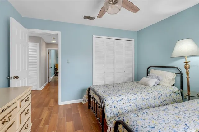 a bedroom with a bed and a lamp on table