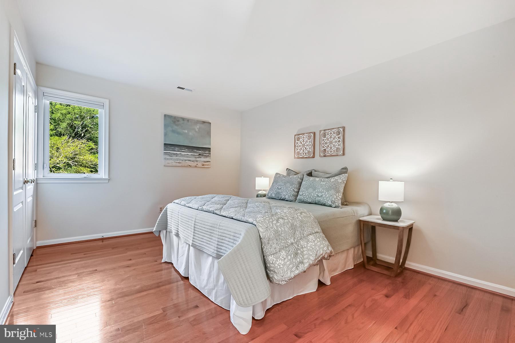 4119 Waterview Drive Edgewater, MD 21037 - Photo 15 of 20 a bed room with a bed and a lamp