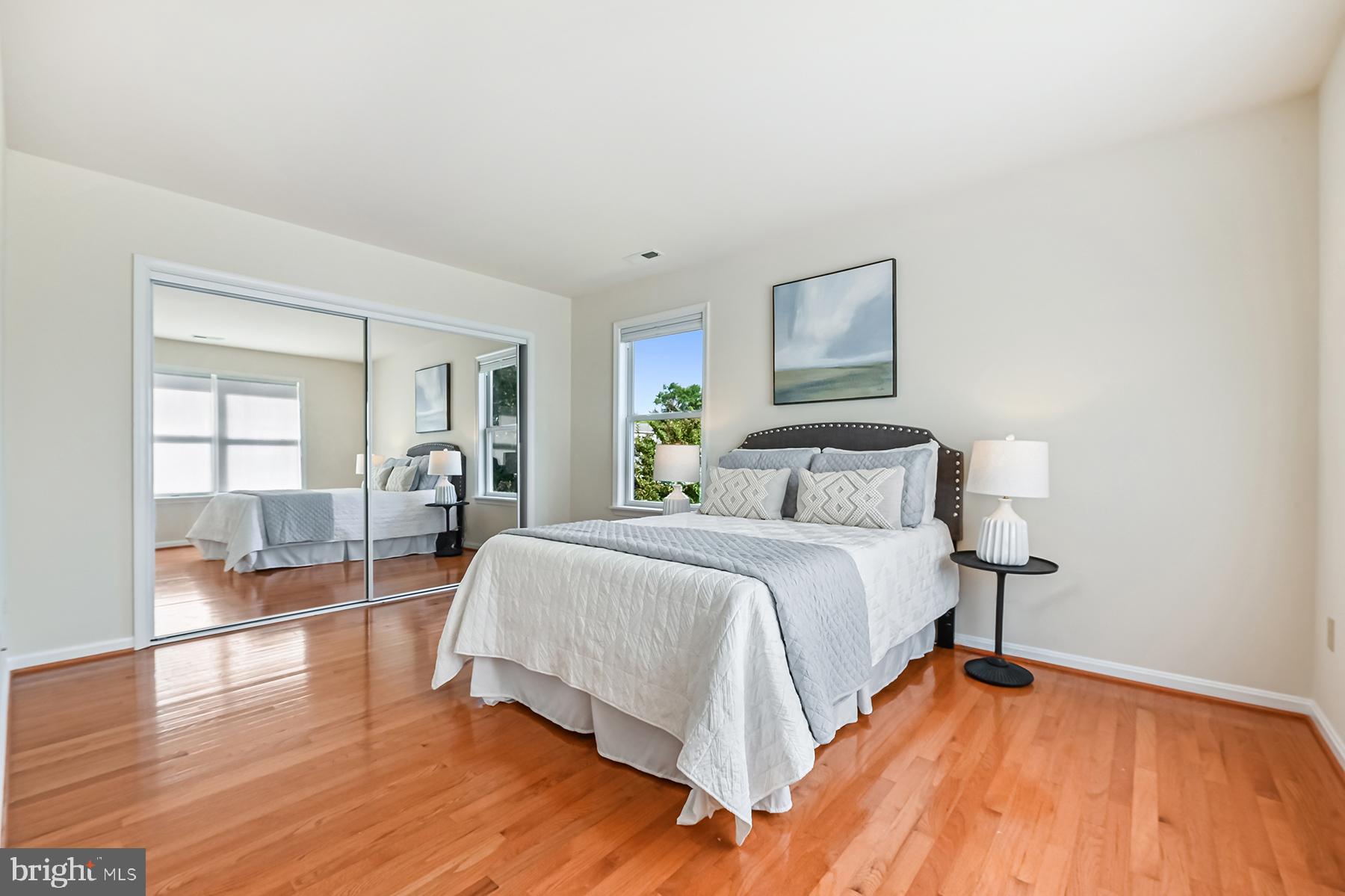 4119 Waterview Drive Edgewater, MD 21037 - Photo 16 of 20 a spacious bedroom with a bed and wooden floor
