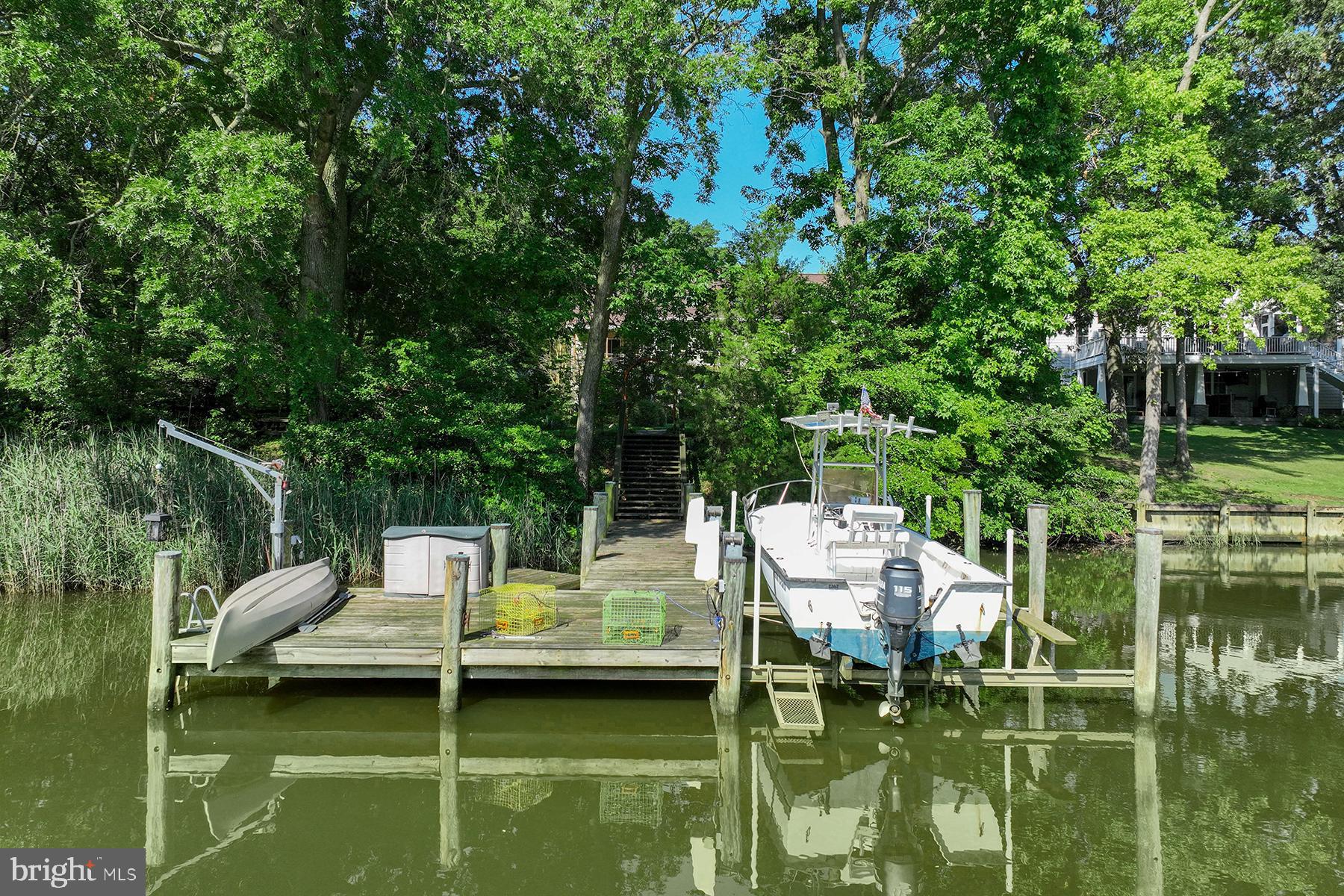4119 Waterview Drive Edgewater, MD 21037 - Photo 2 of 20 a view of a lake with water fountain and trees