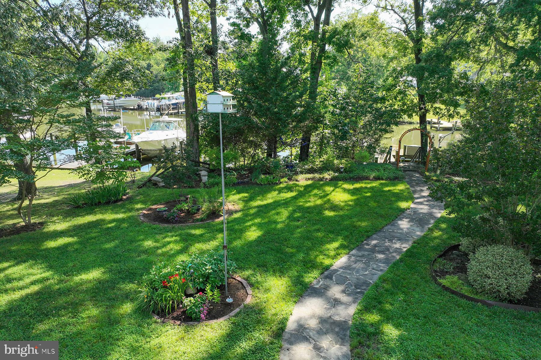 4119 Waterview Drive Edgewater, MD 21037 - Photo 4 of 20 a view of a garden with a lake