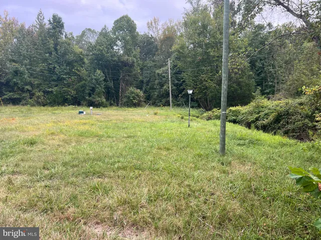 a view of a swimming pool from a yard