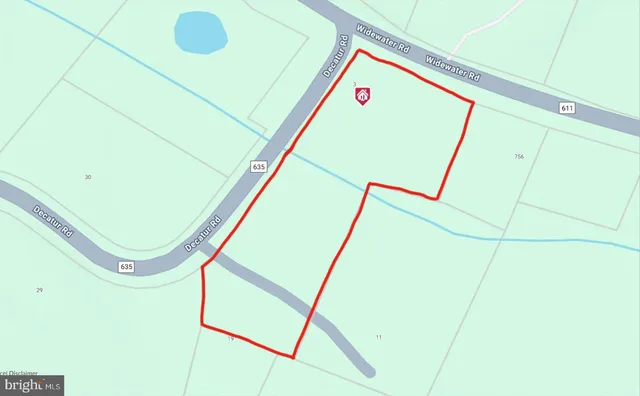 a view of a storage and utility room with a sink