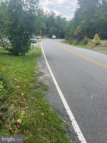 a view of a road with a yard
