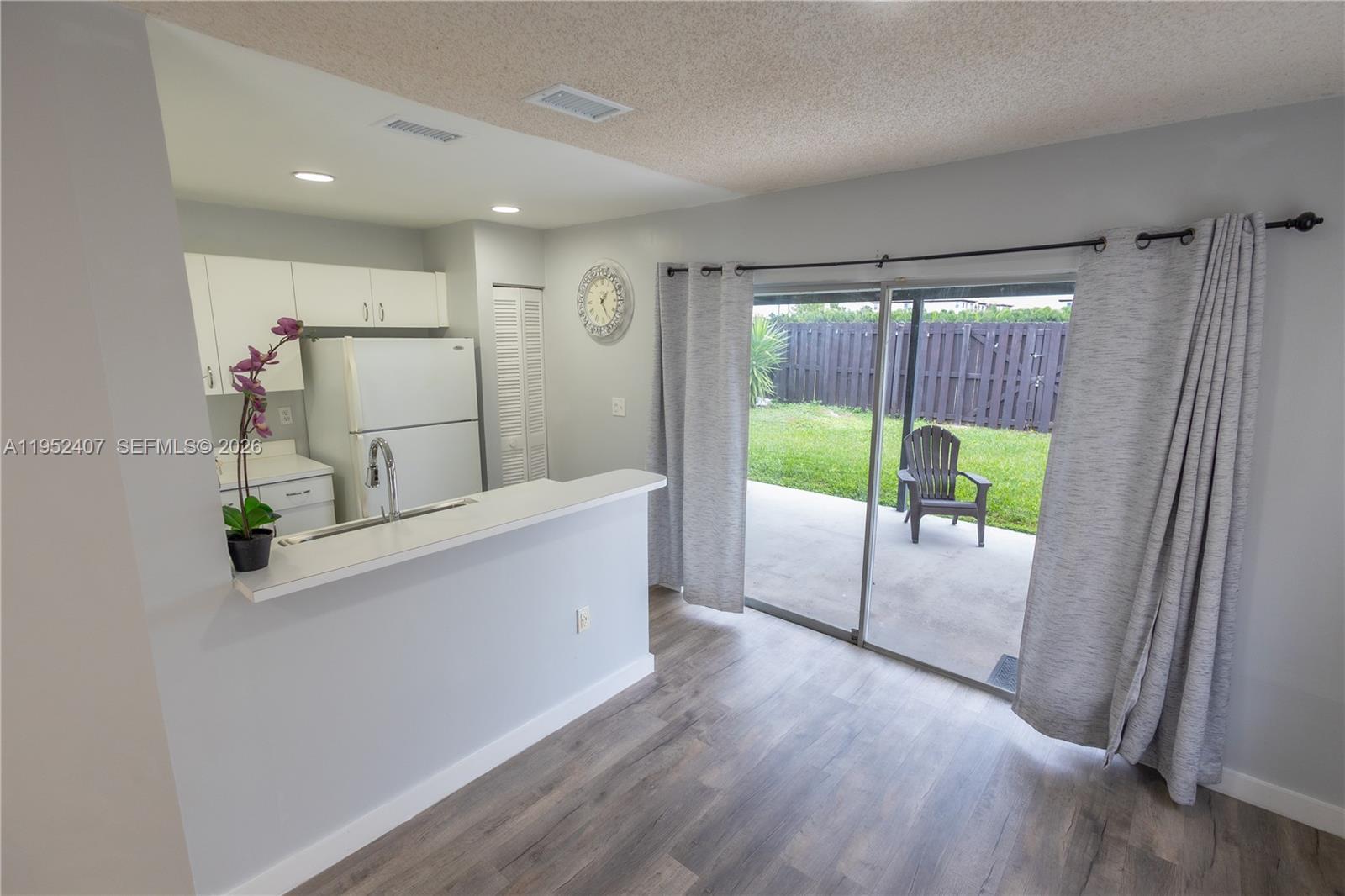 16831 Southwest 139th Place Miami, FL 33177 - Photo 12 of 39 a view of kitchen with furniture and large window
